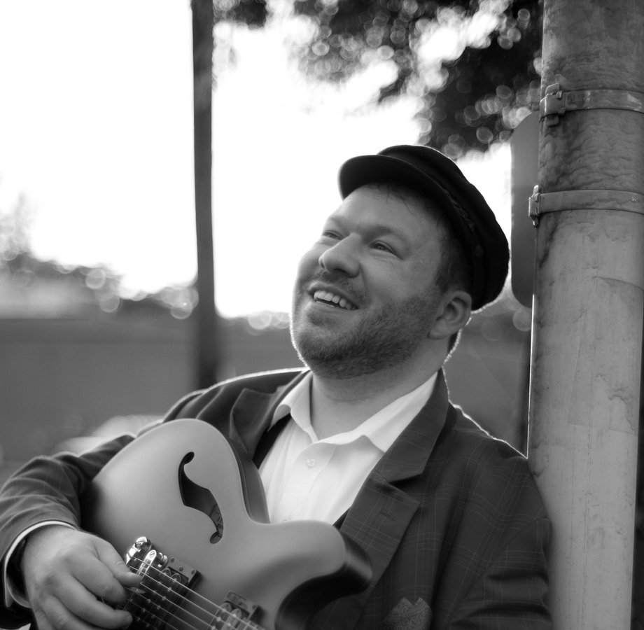 Jeremy with guitar &mdash; black and white portrait