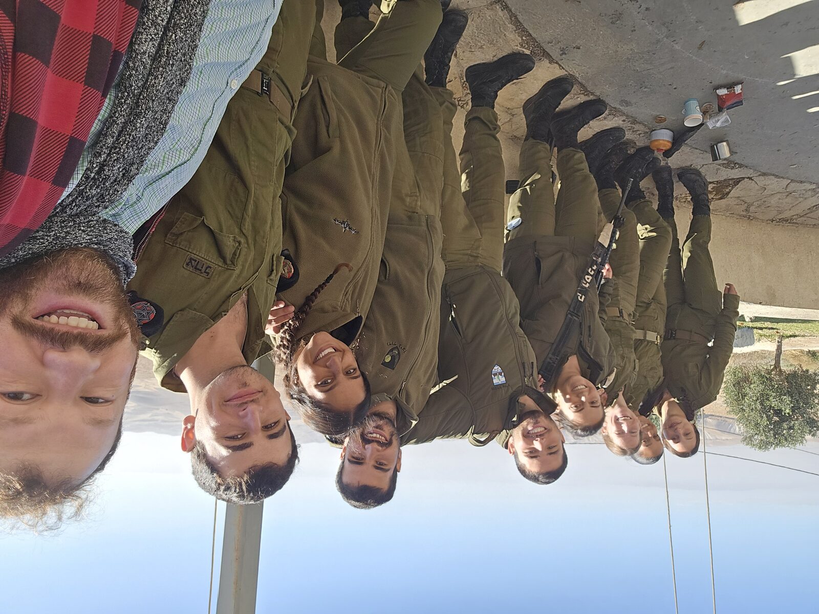 With IDF soldiers under a canopy in daytime