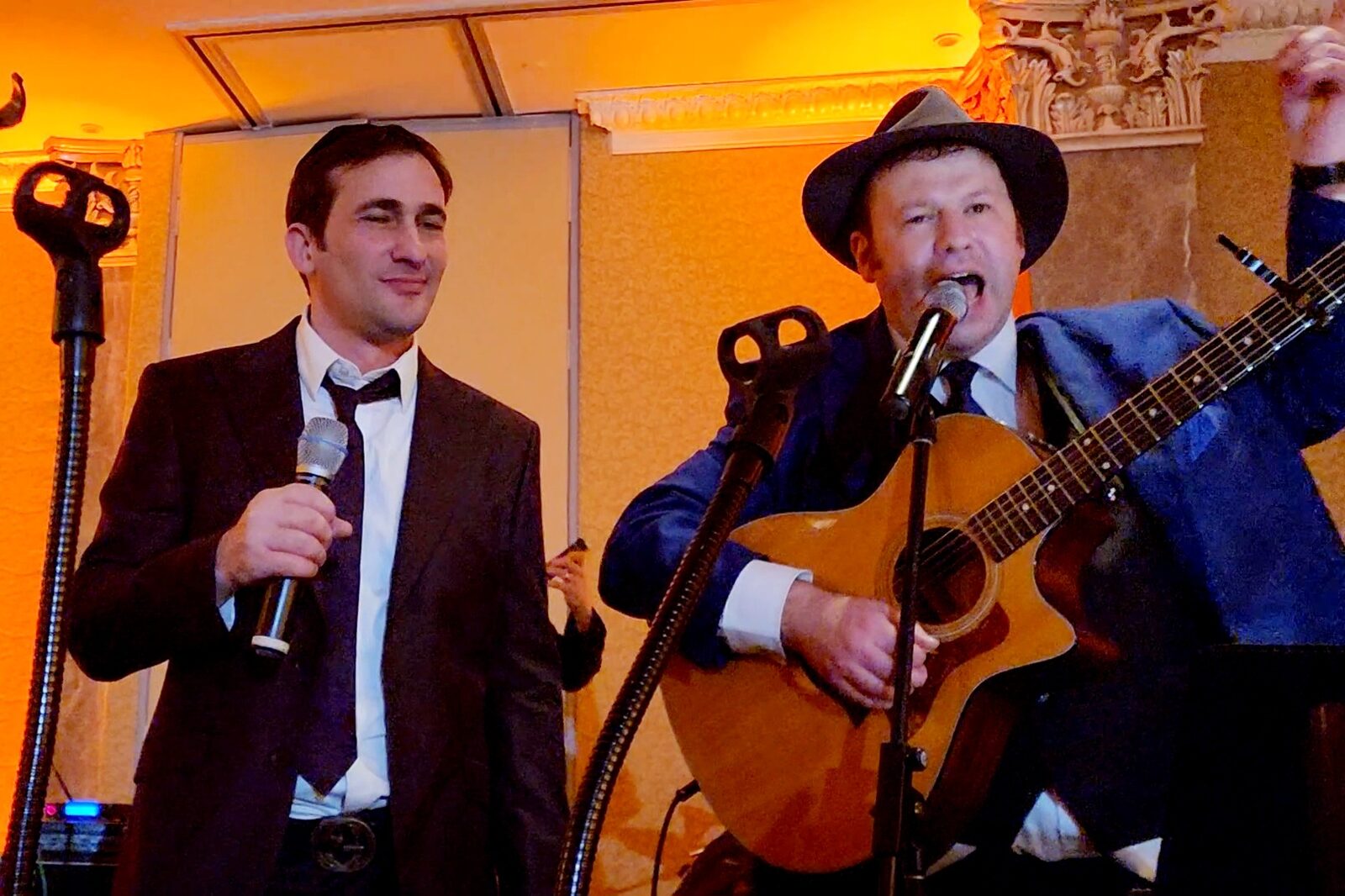 Onstage with Yossi Lebowitz at a wedding