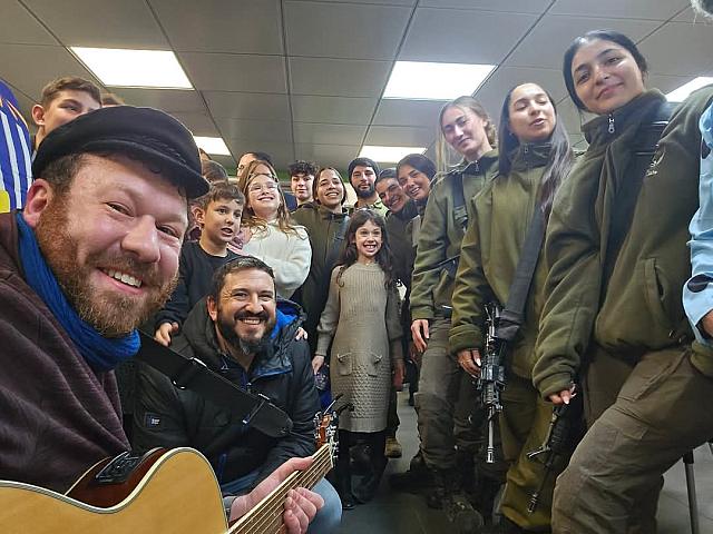 With soldiers and a visiting family on base during Chanukah, Beitar Illit